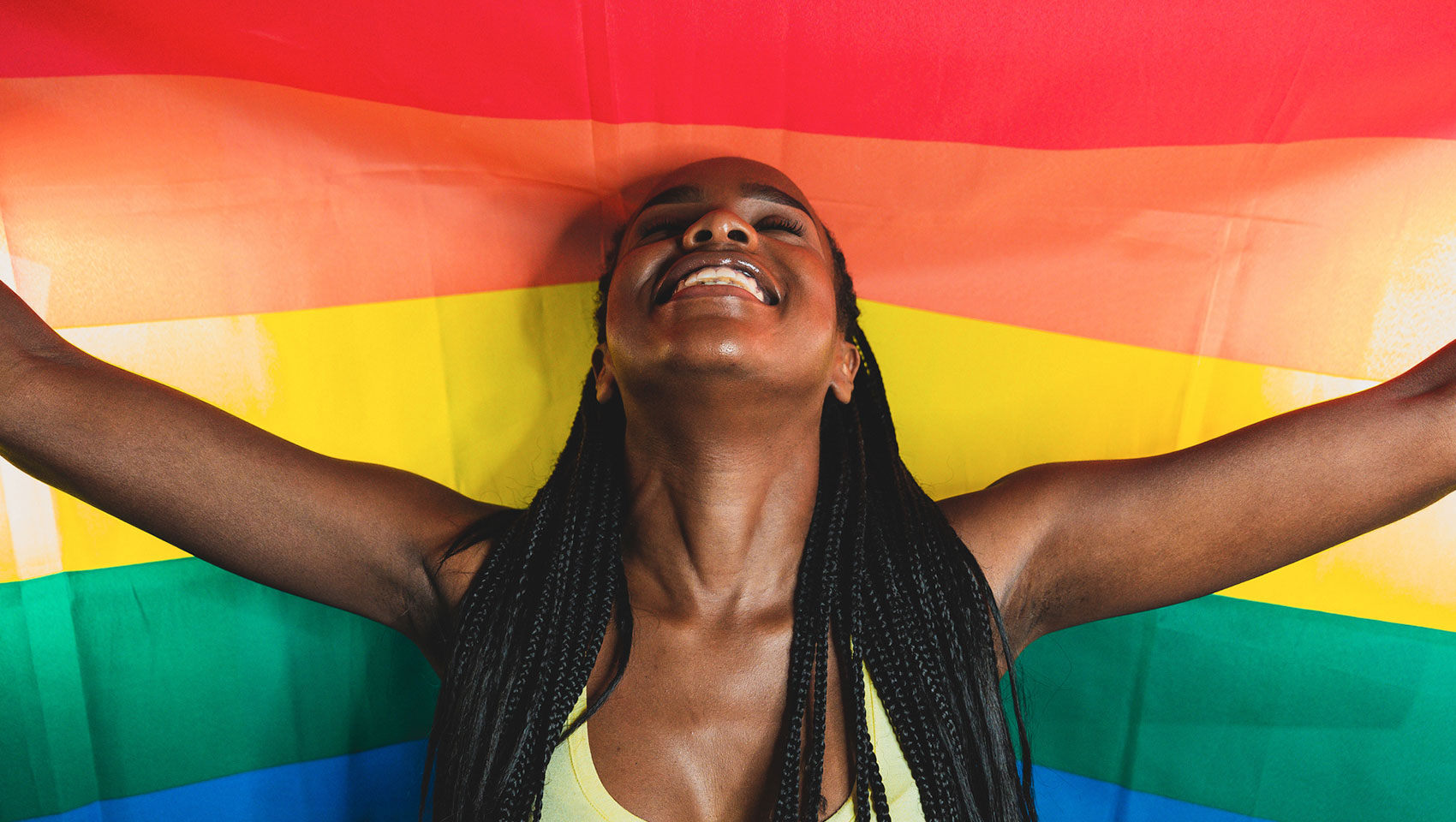 Woman standing with pride flag