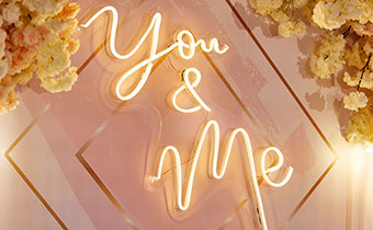 the words 'You & Me' in flourescent lights